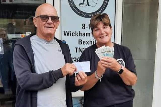 Mick Davies handing over the donation to WUTH chief executive Judy Hampton | Picture from OBWFC