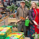 Clive Gravett from The Budding Foundation hands over the gardening goodies to Amy from Friends of We