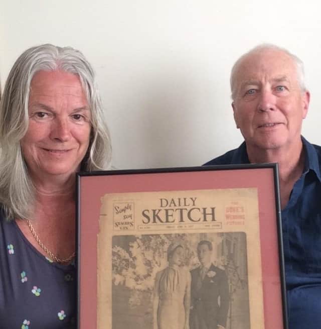 Jane Bramwell and Michael Brand holding the Wallis wedding newspaper June 4 1937