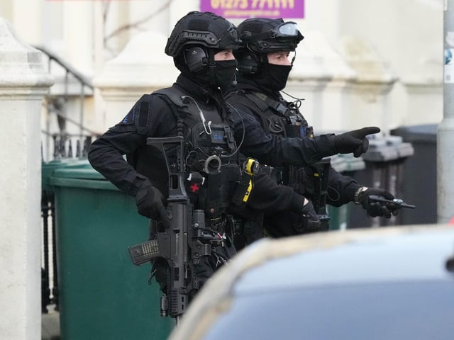 Photos show major police response and armed officers in Hove