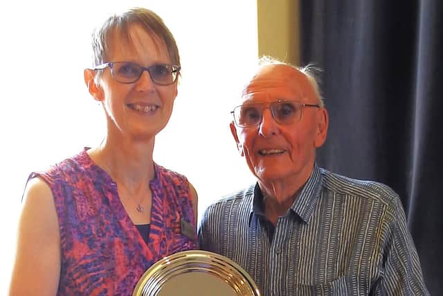 Wally Burrows presents the silver salver to Caroline Griggs in memory of his late wife, Moyna Burrows. Picture: Annette Quelch / Submitted