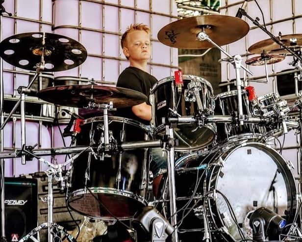 Ten-year-old Marshall Lawrence on the drums at his first public gig with the band Union. Photo: Louise Phillips Photography