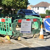 Water was seen running down Park Road, Burgess Hill, from a cordoned off construction area on London Road on Friday, April 12