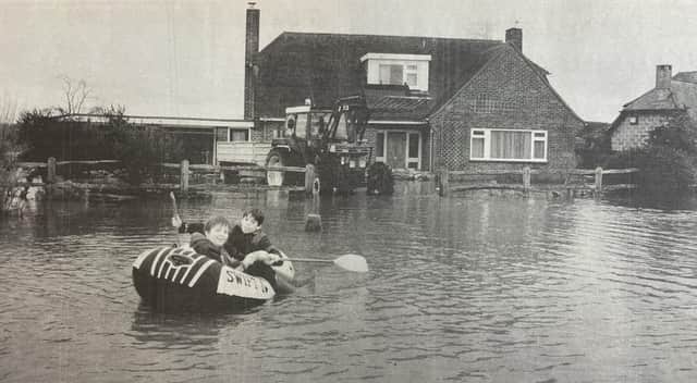 Christopher Gent and Dominic Moor made the most of the floods, taking 'the only sensible transport in East Lavant'.