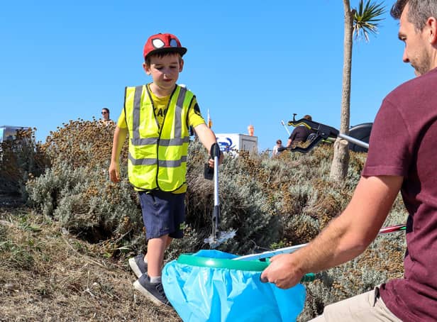 Thomas Chapman, 6, picking up litter with dad Ryan