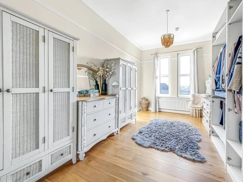 The fourth bedroom is currently used as a walk-in wardrobe