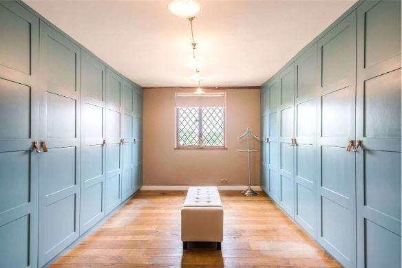 Bedroom four is fitted as a dressing room with an extensive range of fitted wardrobes; the remaining three bedrooms on the first floor are served by a large family bathroom