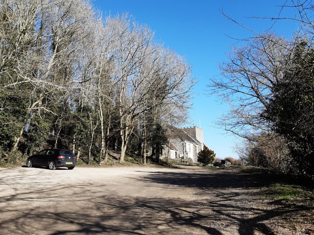 Continue through the car park towards the church.