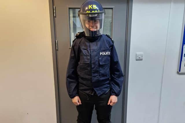 Reporter Sam Morton got to try on police riot gear. Photo: SussexWorld