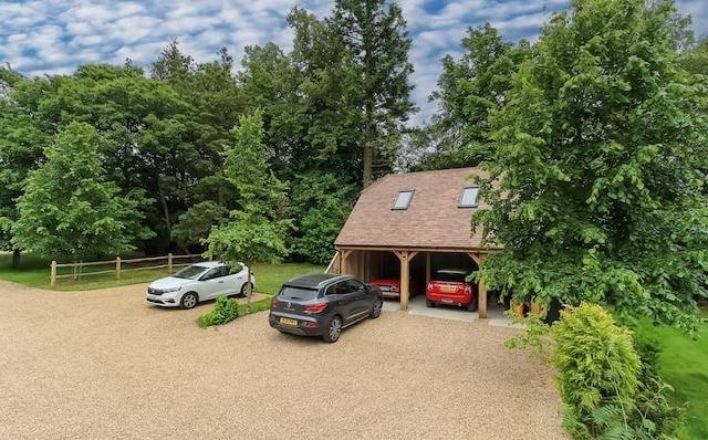 There is a spacious off road parking area with two and a half bay car barn and room over.