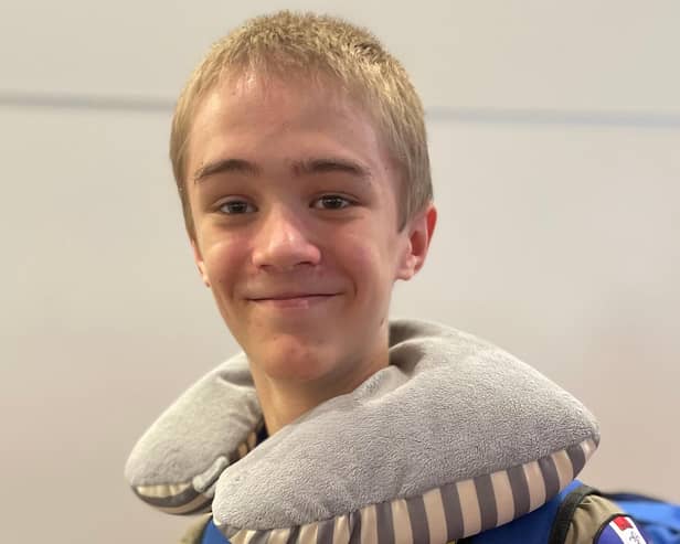 Joe Mace, 16, at departures in Heathrow before flying out