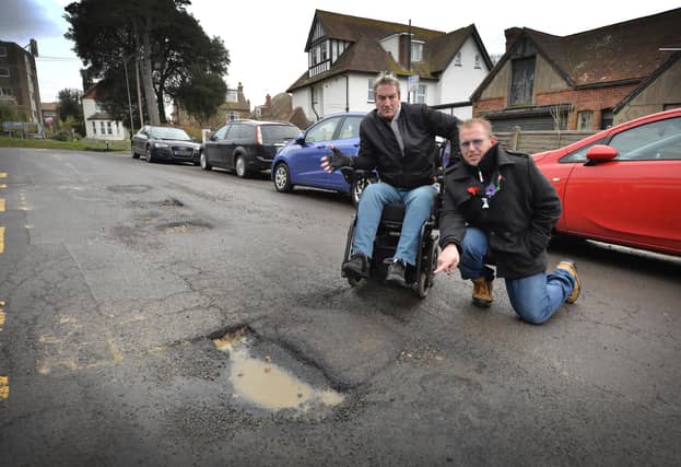 Buckhurst Road potholes and uneven road surface in Bexhill. Councillors John Lee, left, and Andrew Crotty.