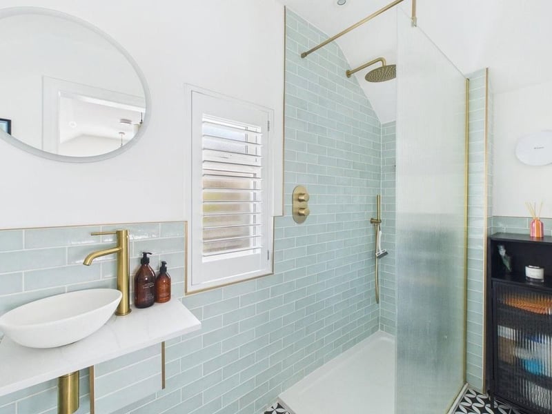 The shower room has been finished with a contemporary suite