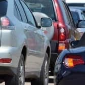 A road in East Sussex has been closed following a collision involving an overturned cement truck.