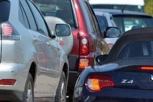 A road in East Sussex has been closed following a collision involving an overturned cement truck.