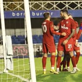 Worthing celebrate one of their three goals at Farnborough | Picture: Mike Gunn