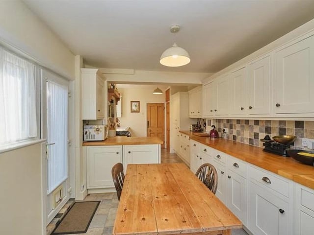 The dining room over looks and opens onto the rear garden, whilst the dual aspect 22' kitchen diner has matching wall and base cupboards, work surfaces, integrated appliances and French doors which also lead onto the rear garden.