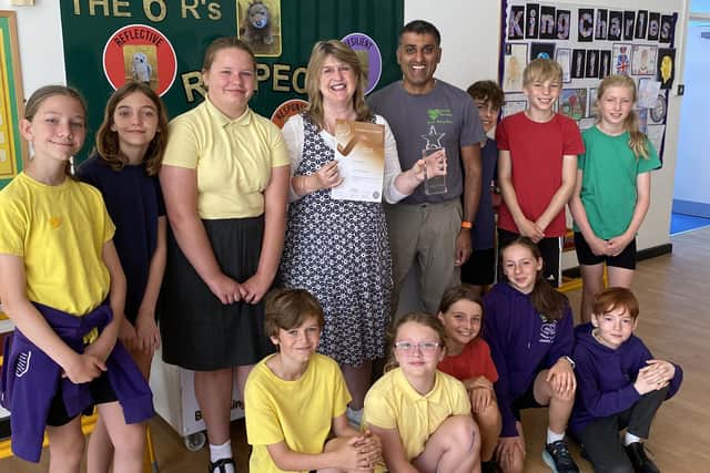 Nicola Davenport, headteacher of Leechpool Primary School, Horsham, with some of the school's staff and pupils. Photo contributed