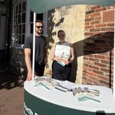 Pearce and Maria hand out leaflets