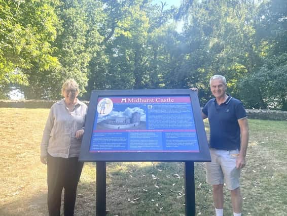 Cllr Jeanette Sutton and District Cllr Gordon McAra with one of the new display boards on St Ann's Hill.