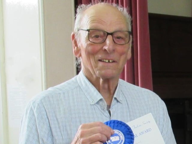 Peter Jenkins with his British Fuchsia Society rosette