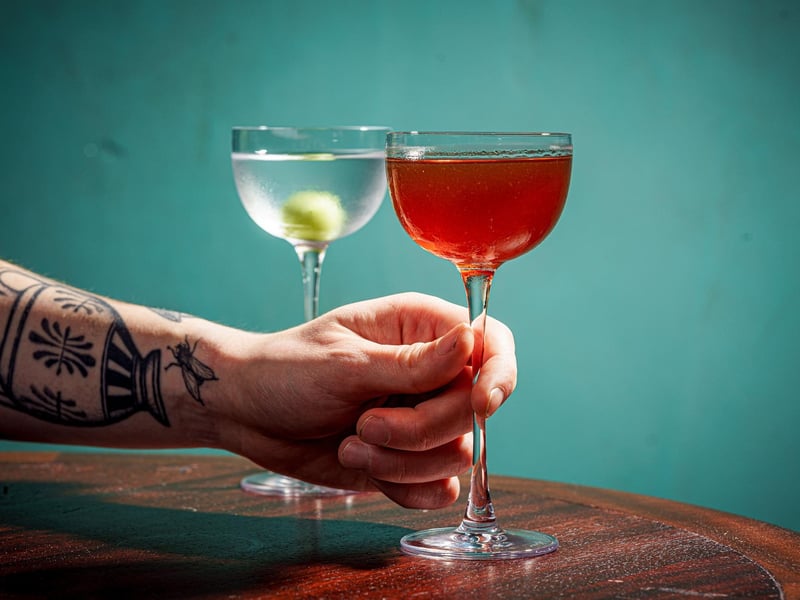 A Thums Up Sazerac - An old-school classic of rye whiskey, cognac. bitters and absinthe, sweetened with a reduction of Thums Up (an Indian cola).