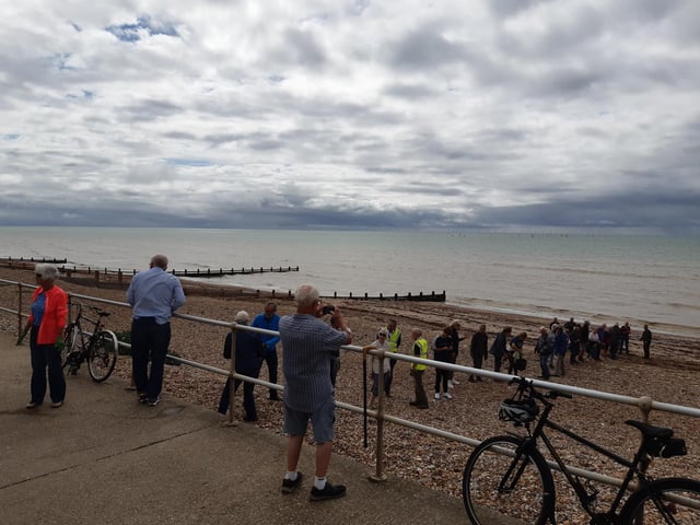 A bucket chain of volunteers from Ferring History Group and Ferring Conservation Group, including Worthing West MP Sir Peter Bottomley, form a bucket chain to bail out nine inches of water from the Ferring pillbox
