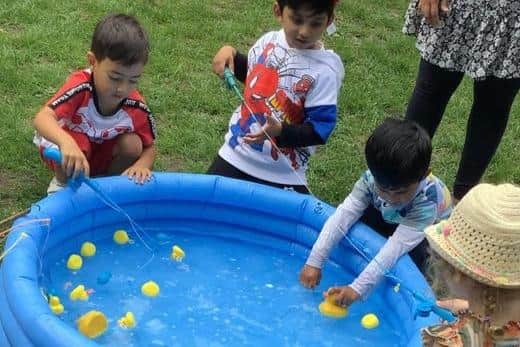 The children enjoying the ‘Hook a Duck’ game at Kiddi Caru Day Nursery, Burgess Hill’s Family Fun Da