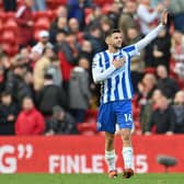 Brighton's English midfielder Adam Lallana acknowledges the Liverpool fans after the English Premier League football match between Liverpool and Brighton and Hove Albion at Anfield in Liverpool, north west England on October 30, 2021.  (Photo by PAUL ELLIS/AFP via Getty Images)