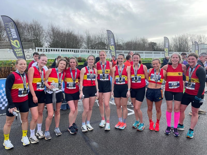 Smiles and medals all round for Lewes AC women after a successful Chichester 10k