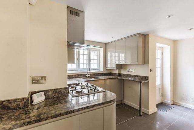 The kitchen comes with built-in appliances.
