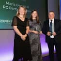 Maria Dennis being presented with the award