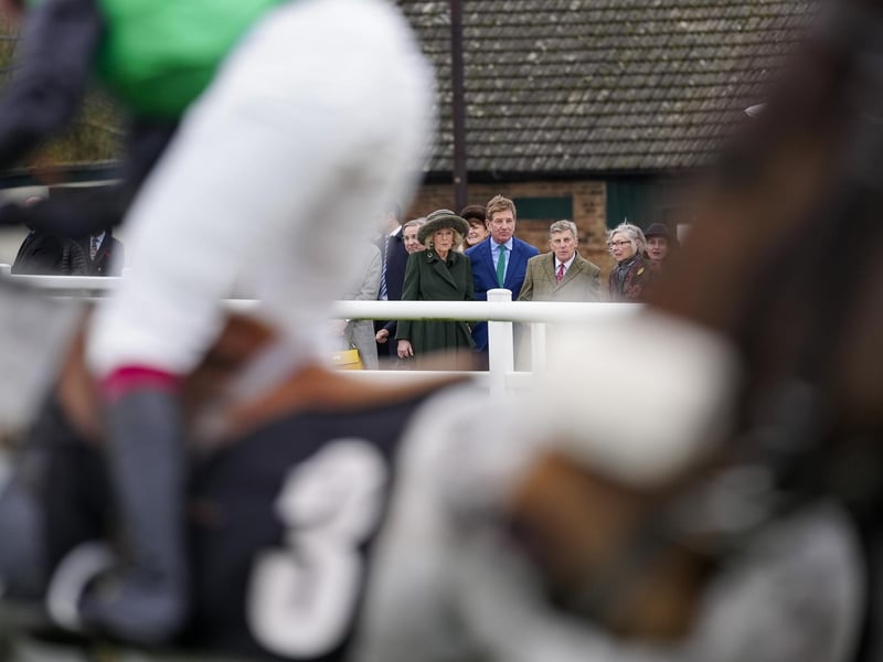 PLUMPTON, ENGLAND - FEBRUARY 23: Queen Camilla watches The Johnnie Boden Backs Jamie's Farm Amateur Jockeys' Handicap Chase during a visit for a charity event at Plumpton Racecourse on February 23, 2026 in Plumpton, England. (Photo by Alan Crowhurst/Getty Images) : Queen Camilla watches The Johnnie Boden Backs Jamie's Farm Amateur Jockeys' Handicap Chase at Plumpton