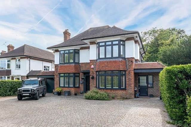 This five-bed, detached home with a gated entrance is on the market for offers over £1.35million