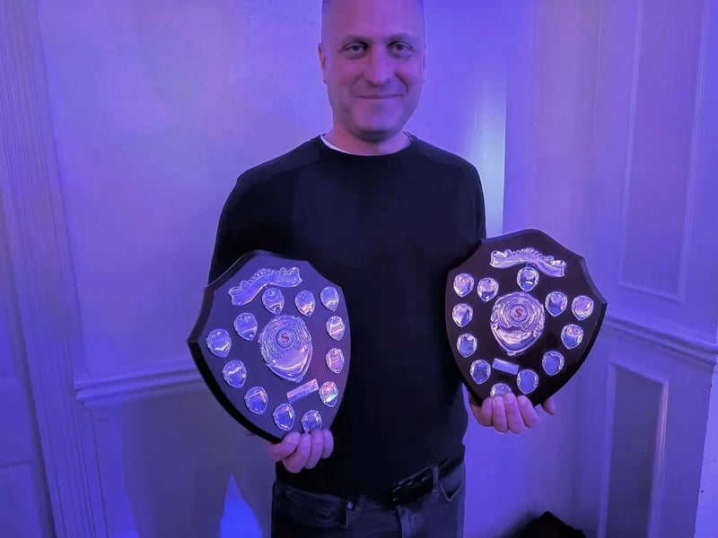 Miles Ockwell, Arundel Pétanque Club Captain, with 6-a-side and 9-a-side winning divisional trophies