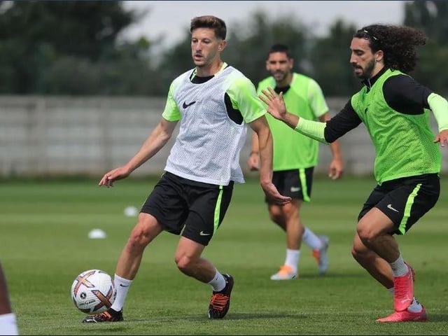 Adam Lallana and Marc Cucurella tussle for possession