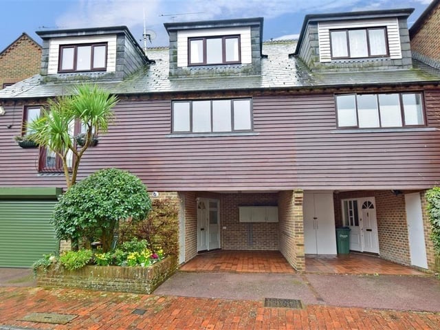 This modern town house with waterside garden is tucked away on a desirable private development in the heart of Arundel. It comes to the market with Cubitt & West, priced at £700,000.