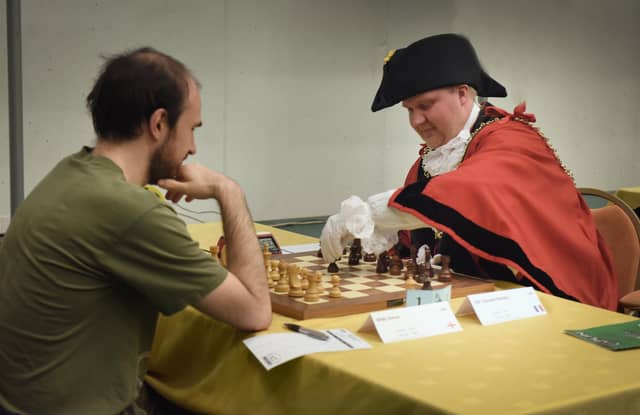 Start of the 96th Caplin Hastings International Chess Congress December 28 2022. Councillor James Bacon, Mayor of Hastings, making the first move.