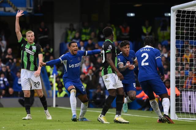 Levi Colwill began to celebrate after scoring for Chelsea against Brighton but paused to show respect to this former colleagues and fans. (Photo by Mike Hewitt/Getty Images)