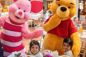 Isadora, age 3, pictured with the characters from Winnie the Pooh (Images: Joe Howarth/Make-A-Wish UK)