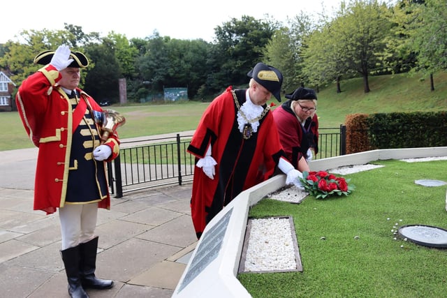 Cllr James Bacon has laid a wreath on behalf of local people at the town's war memorial in Alexandra Park.