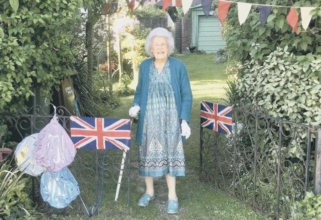 Daphne Jones, who turned 100 in March 2020, outside her Bognor Regis home. Daphne remembered dancing around the Chichester Cross on VE Day in 1945