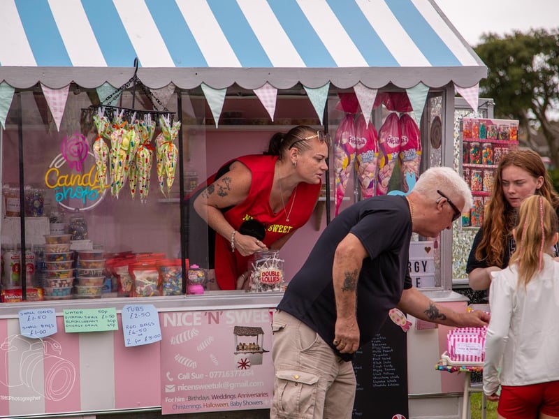 Fete-goers buy themselves a sweet treat.