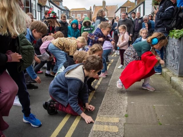 The old custom of scrambling for hot pennies in Rye