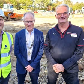 Lee Snelling (Project Manager, MCS group Ltd), Stuart Condie (Burgess Hill Town Mayor), and Andrew Crabb (Head of Business, Porsche Mid Sussex), marking the start of construction work at the new Porsche Centre, Burgess Hill. | Hollie Robards/Iconic Media Group