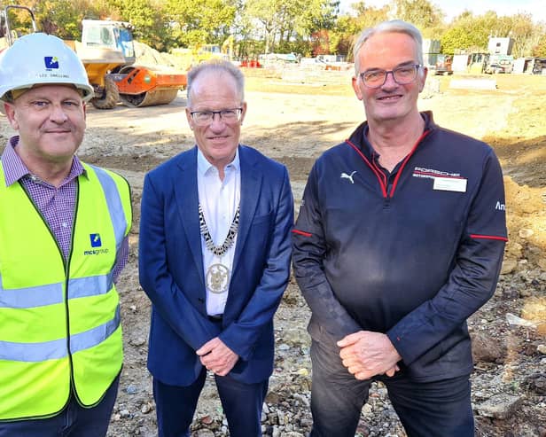 Lee Snelling (Project Manager, MCS group Ltd), Stuart Condie (Burgess Hill Town Mayor), and Andrew Crabb (Head of Business, Porsche Mid Sussex), marking the start of construction work at the new Porsche Centre, Burgess Hill. | Hollie Robards/Iconic Media Group
