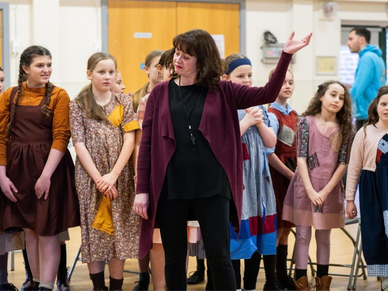 Jasmine London-Willis, Darcy Harris-Smith (Pepper), Charlotte Howard (July), Suzanne Britten (Miss Hannigan), Delilah Fitt (Tessie), Cara Anderson, Bella Guy and Grace Tutt in WMTC's Annie rehearsals