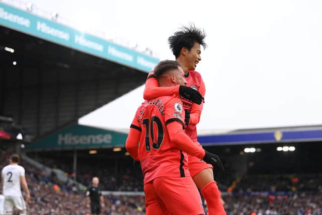 Brighton player Alexis Mac Allister celebrates after scoring the first goal with Kaoru Mitoma during the Premier League match between Leeds United and Brighton & Hove Albion at Elland Road on March 11, 2023 in Leeds, England. (Photo by Stu Forster/Getty Images)