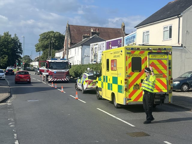 Two people taken to hospital after car collides with building in West Sussex