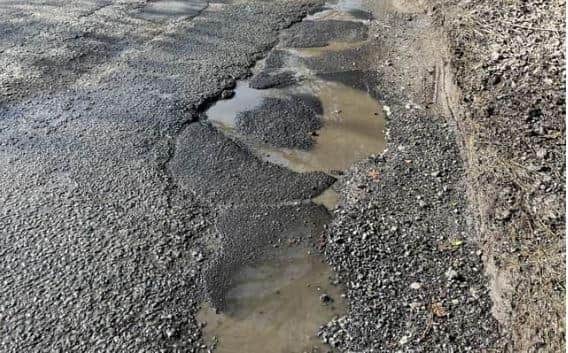 The pothole in Mare Hill Road, Pulborough, which led Linda Wickenden to put in a claim to West Sussex County Council for compensation for the £150 cost of a new tyre. Photo contributed.